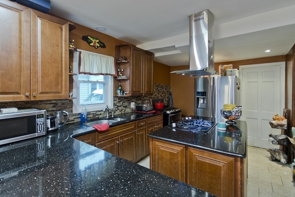 177 Belvidere Street Springfield, MA 01108 - Photo 8 of 24 a kitchen with sink refrigerator and stove