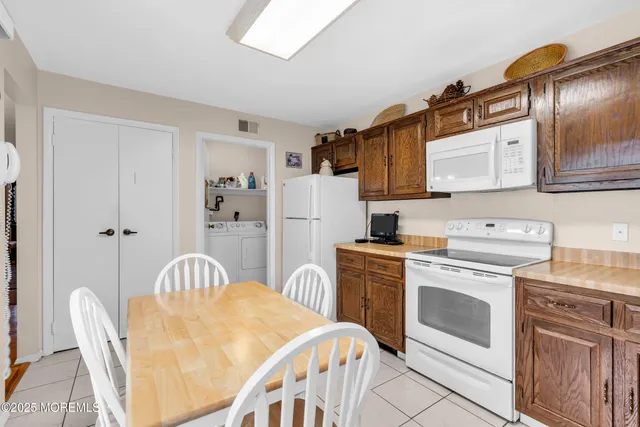 a kitchen with stainless steel appliances a stove a sink dishwasher and cabinets