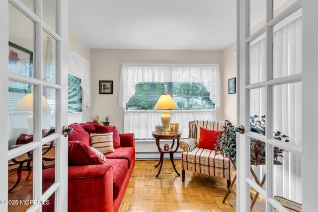 a living room with furniture and a large window
