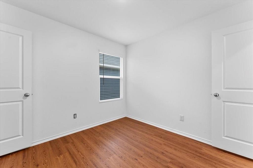 211 Herman Lane Princeton, TX 75407 - Photo 25 of 40 a view of empty room with wooden floor and fan