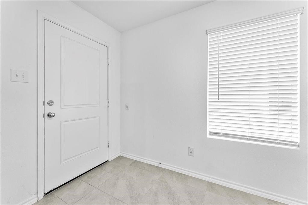 211 Herman Lane Princeton, TX 75407 - Photo 3 of 40 an empty room with a window
