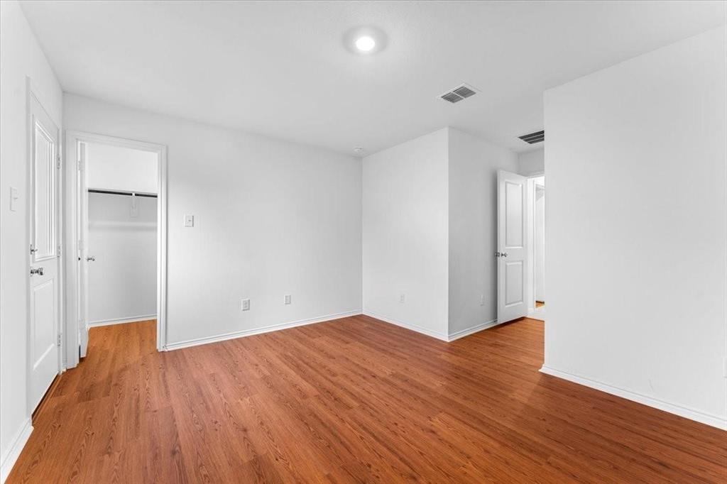 211 Herman Lane Princeton, TX 75407 - Photo 32 of 40 a view of empty room with wooden floor and fan