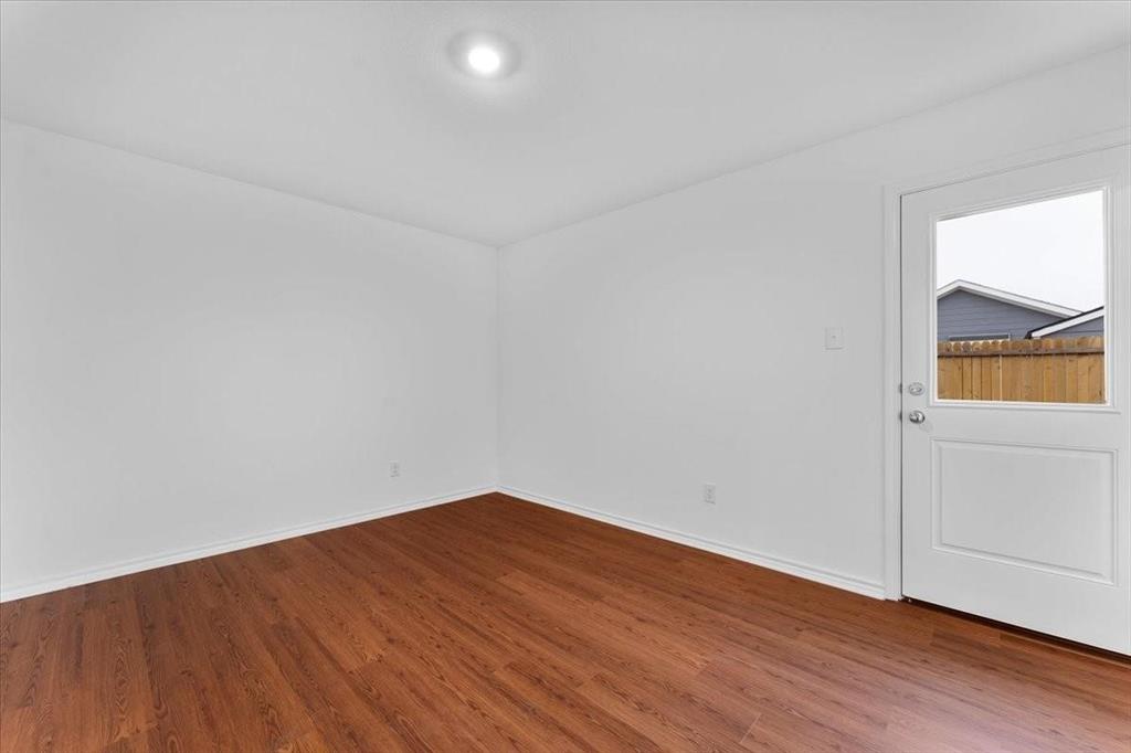 211 Herman Lane Princeton, TX 75407 - Photo 34 of 40 a view of empty room with wooden floor and fan