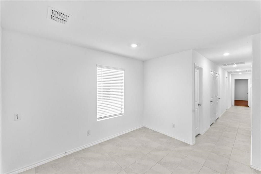 211 Herman Lane Princeton, TX 75407 - Photo 4 of 40 an empty room with windows