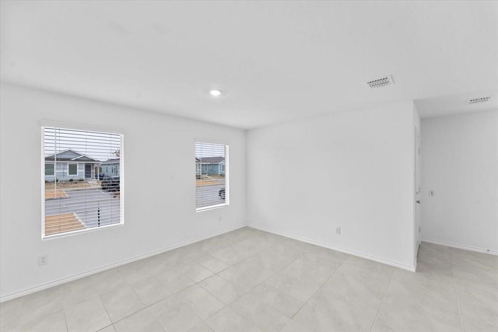 211 Herman Lane Princeton, TX 75407 - Photo 7 of 40 an empty room with windows
