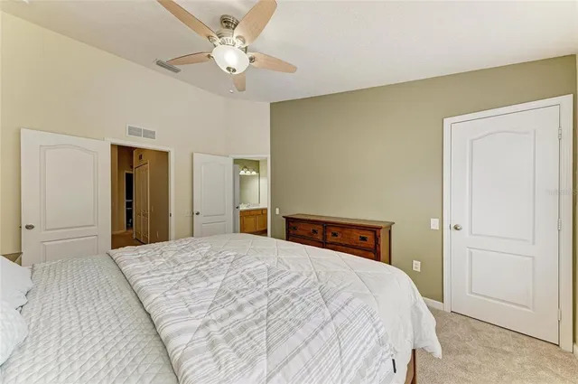 a en suite bathroom with a tub shower and sink