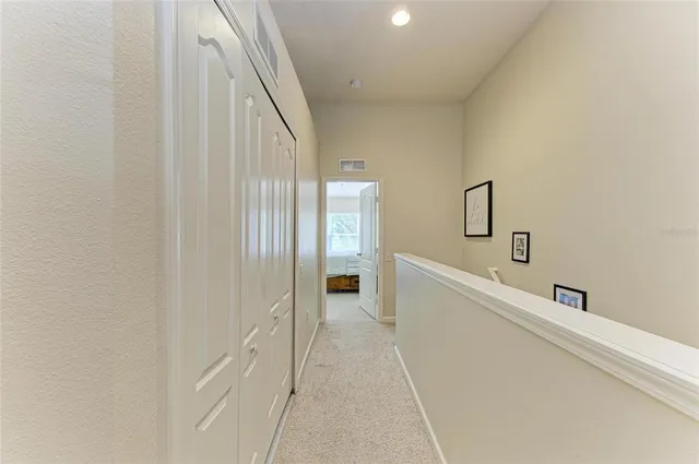 a view of a grassy field with trees