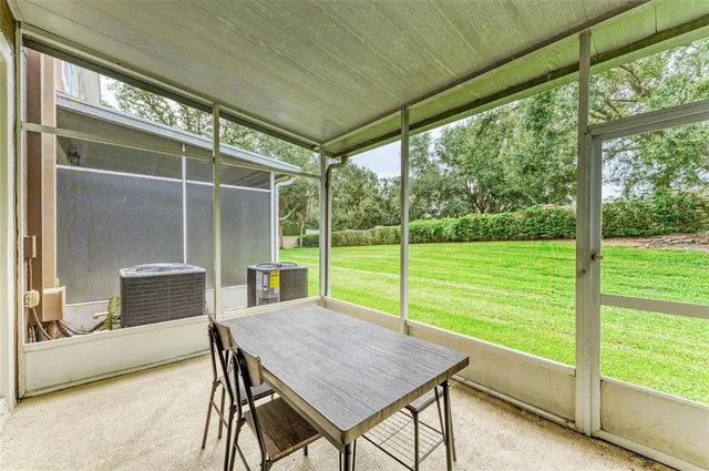 an aerial view of a house with yard