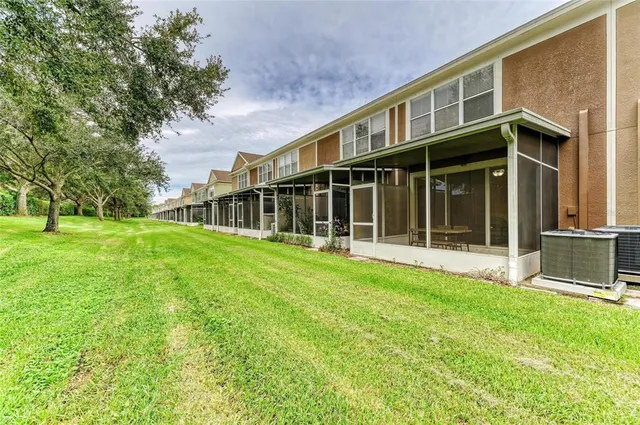 an aerial view of residential houses with outdoor space