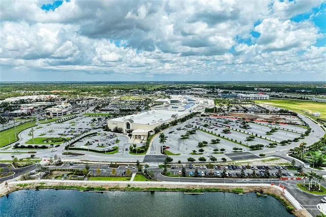 a view of a chairs and table in patio with a barbeque