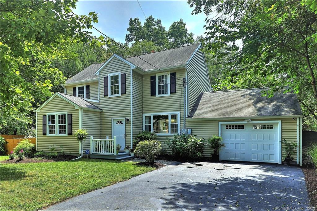 29 Winslow Road Trumbull, CT 06611 - Photo 1 of 1 a front view of a house with a garden and yard