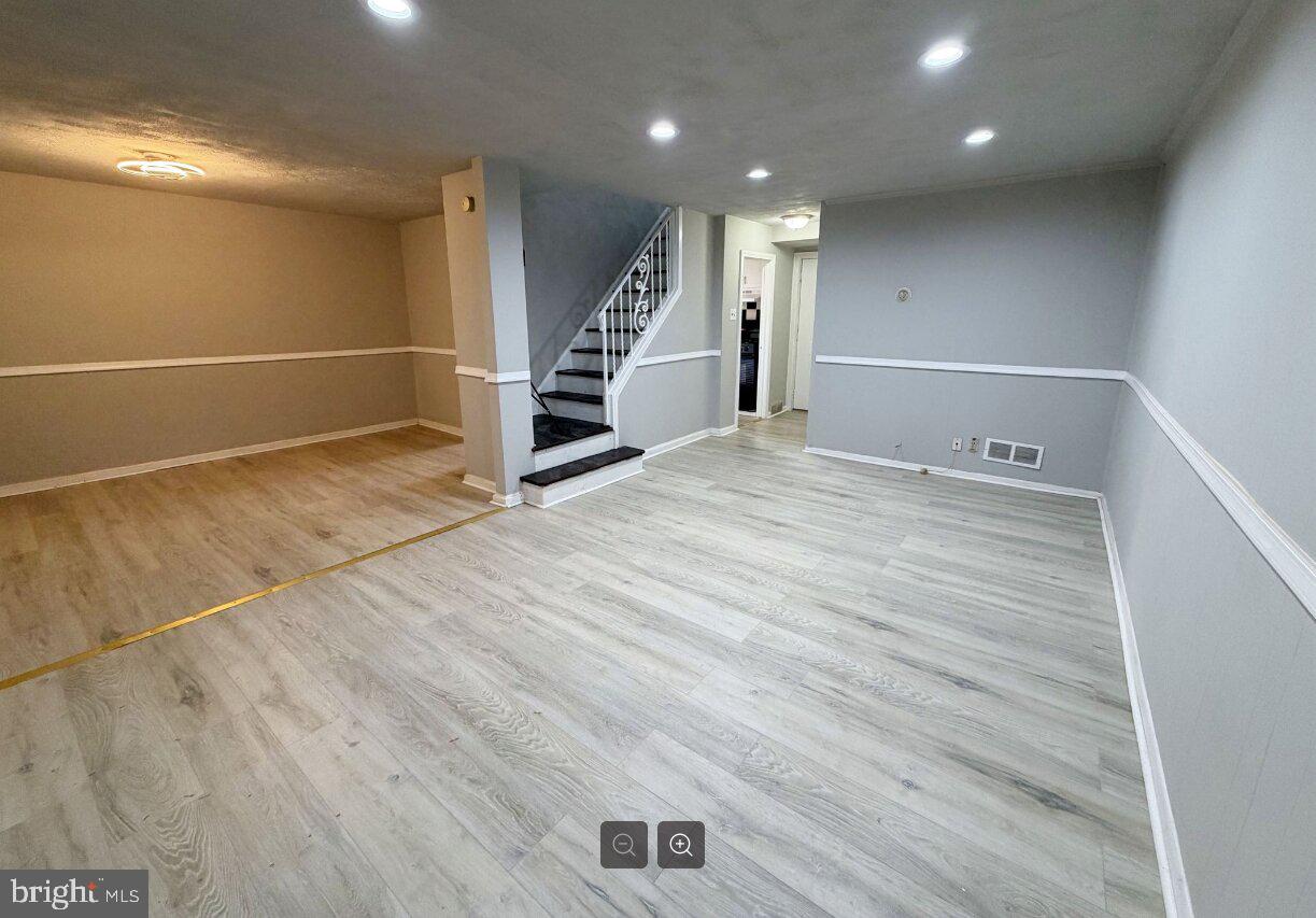 2609 Kane Street Chester, PA 19013 - Photo 3 of 7 a view of an empty room with wooden floor