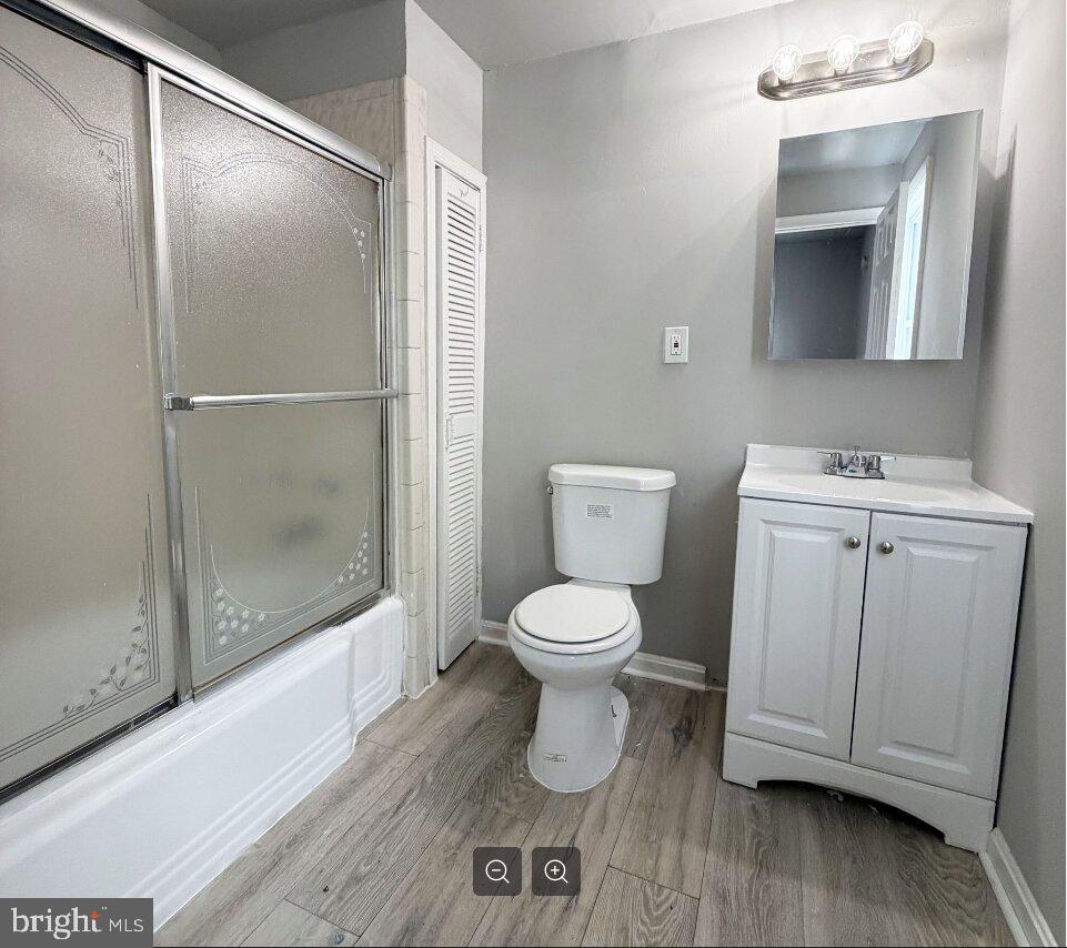 2609 Kane Street Chester, PA 19013 - Photo 6 of 7 a bathroom with a toilet sink and a shower