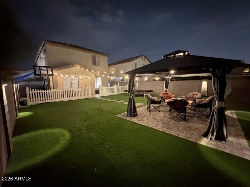 4184 East Trigger Way Gilbert, AZ 85297 - Photo 33 of 51 a patio with table and chairs