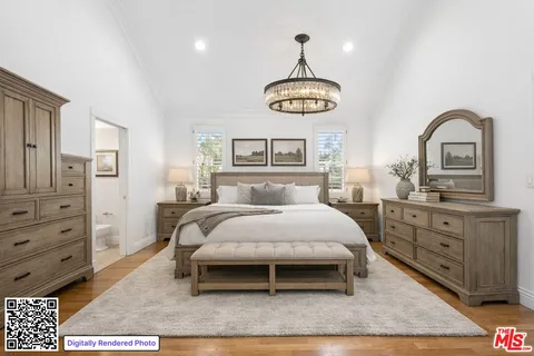 a bedroom with a bed and dresser