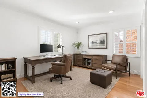 a view of a livingroom with workspace and a couch