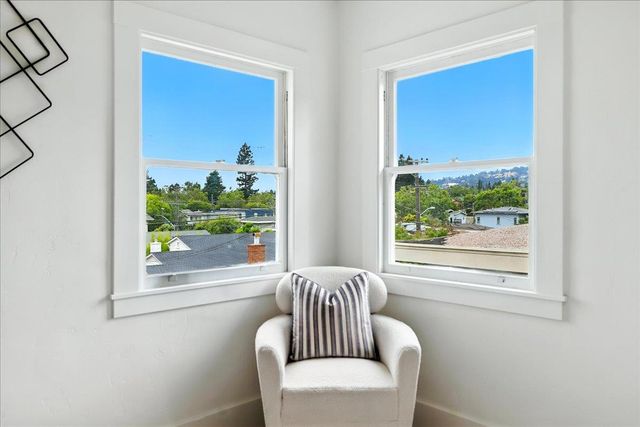 a workspace with furniture and a window