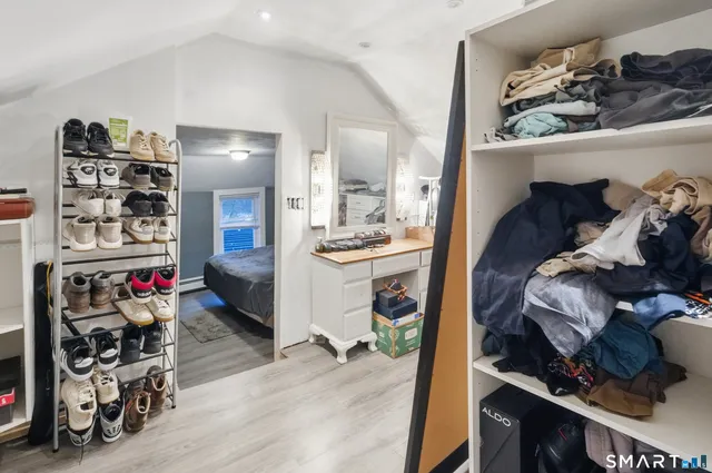 a view of a room with workspace and a living room