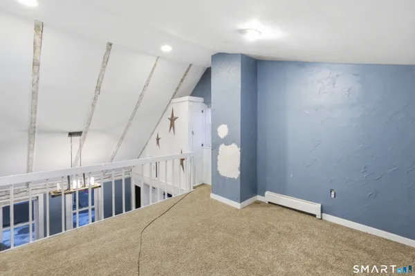 a view of an empty room with stairs