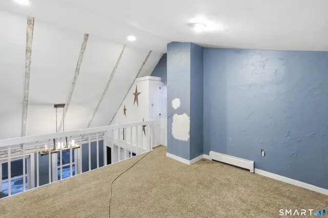 a view of an empty room with stairs