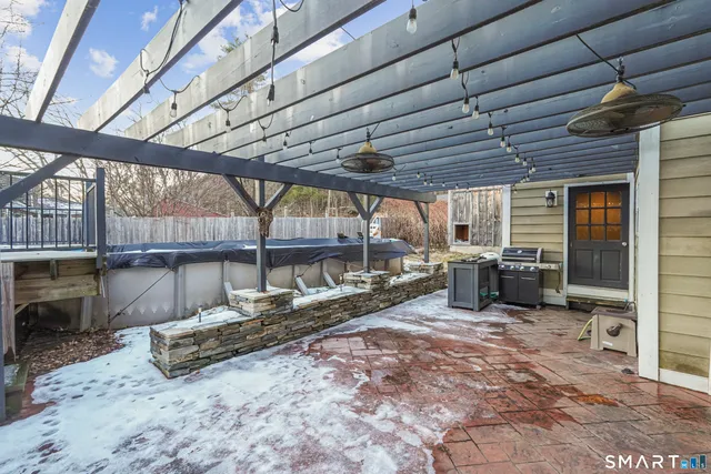 a view of a backyard with table and chairs