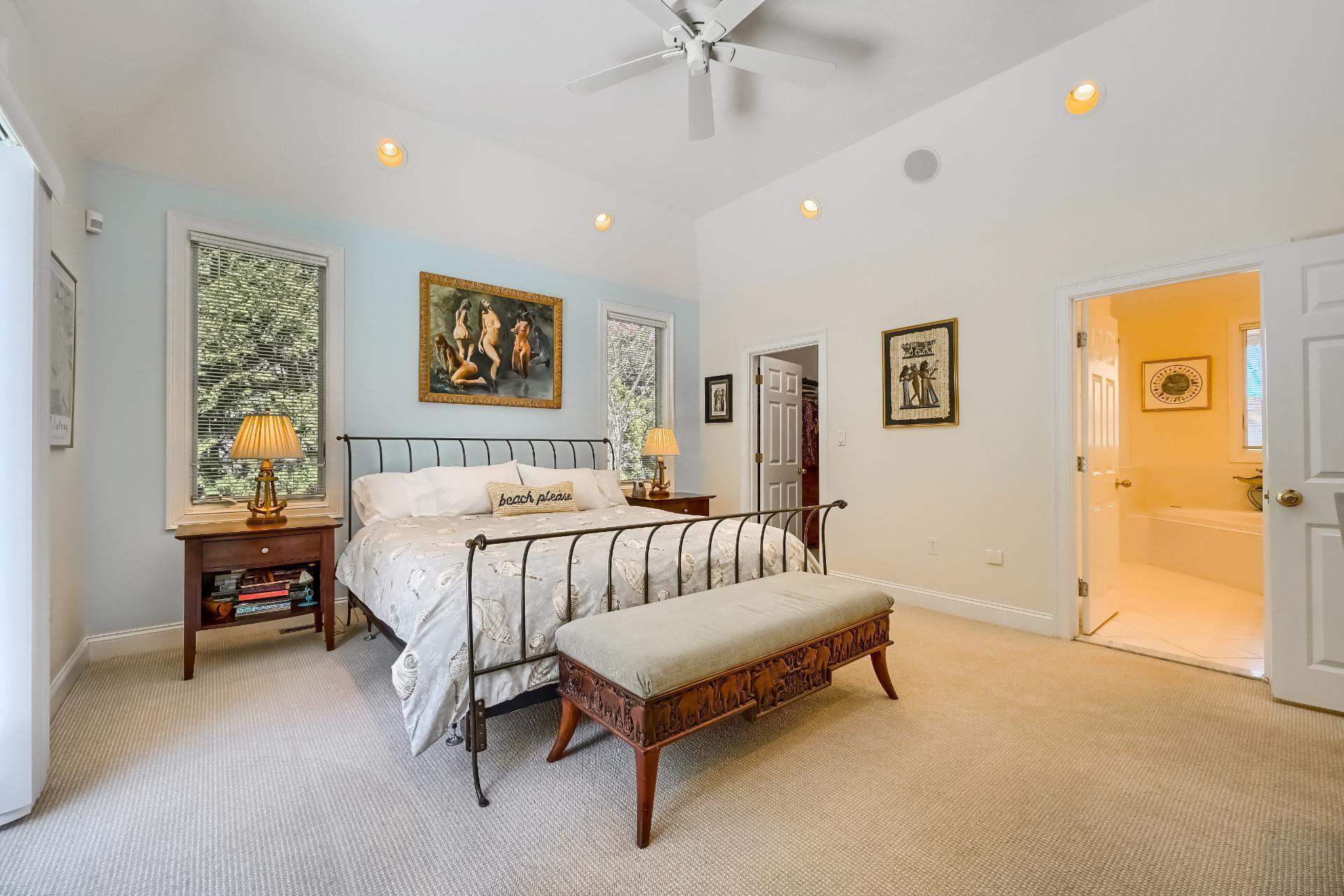 4 Tide Run Mashpee, MA 02649 - Photo 13 of 46 a spacious bedroom with a bed and a table in it