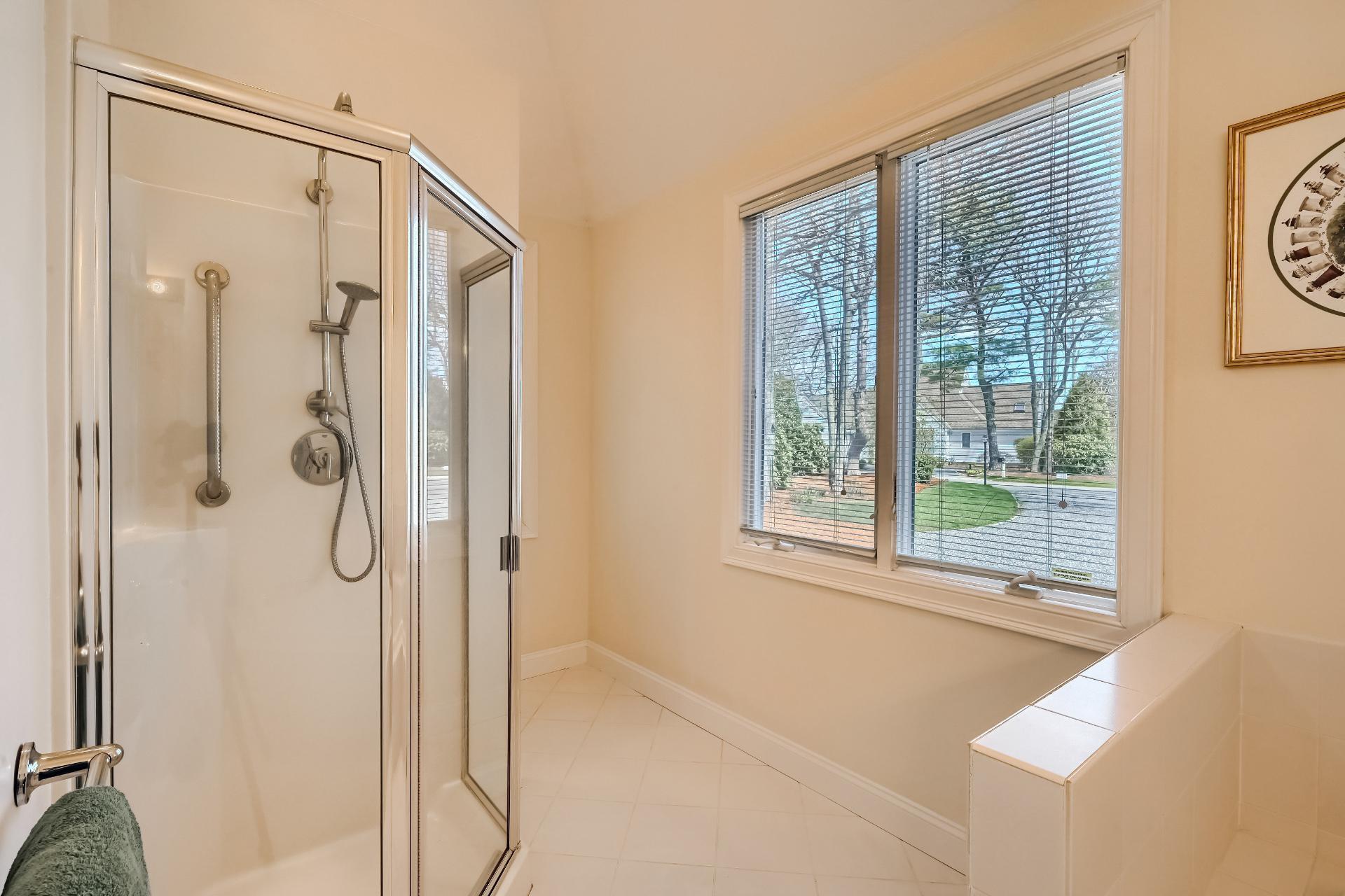 4 Tide Run Mashpee, MA 02649 - Photo 17 of 46 a bathroom with a shower and a window