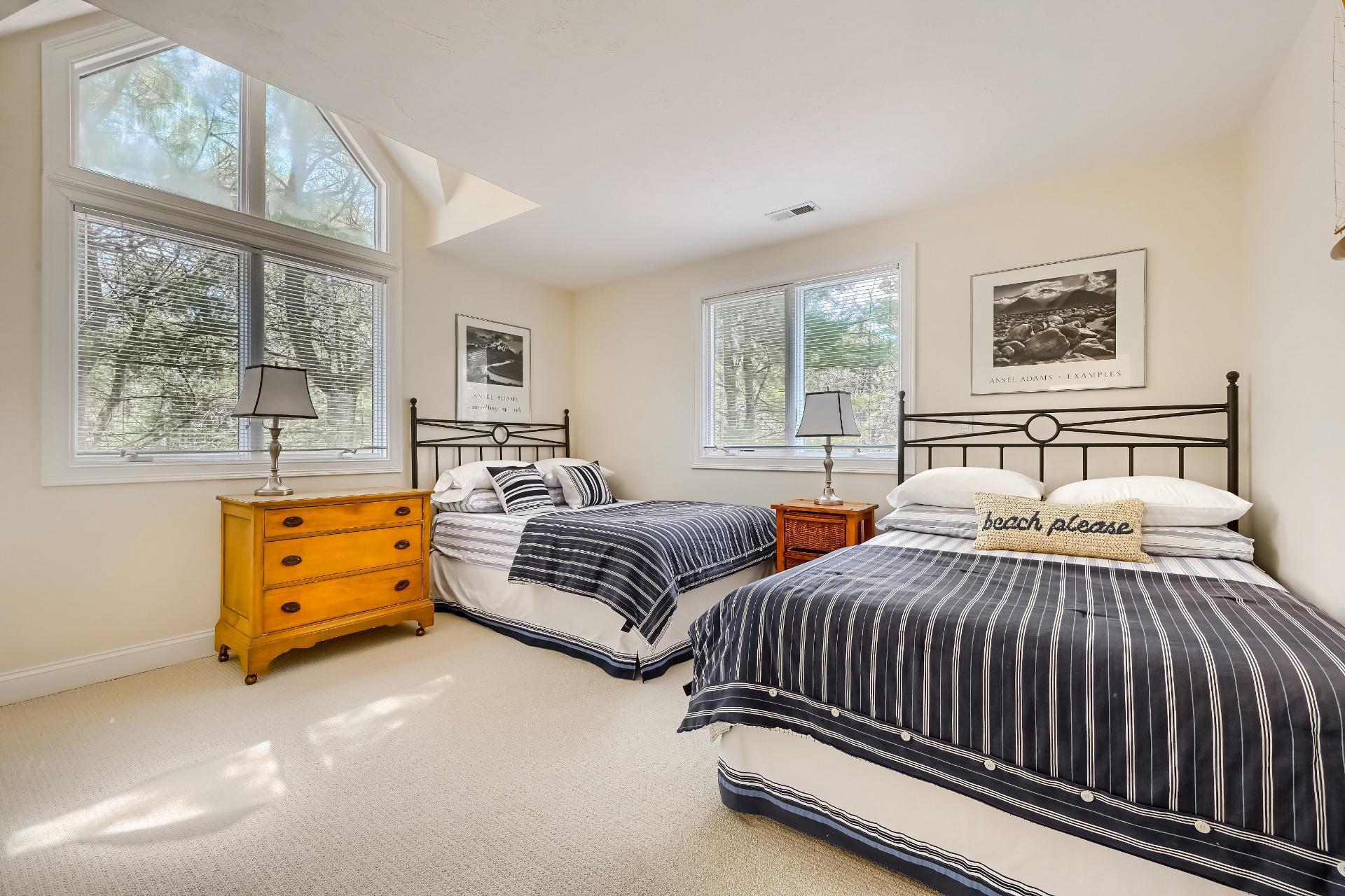 4 Tide Run Mashpee, MA 02649 - Photo 24 of 46 a bedroom with three beds and a large window