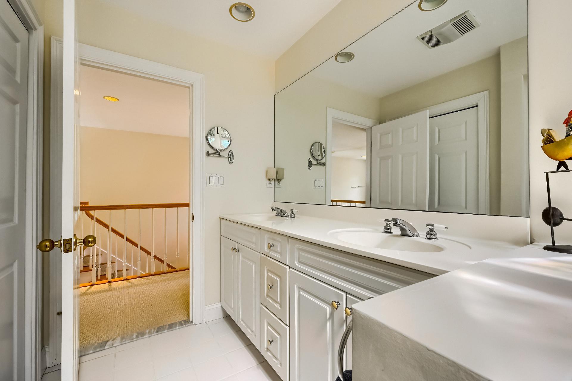 4 Tide Run Mashpee, MA 02649 - Photo 30 of 46 a bathroom with a double vanity sink a mirror and a bathtub