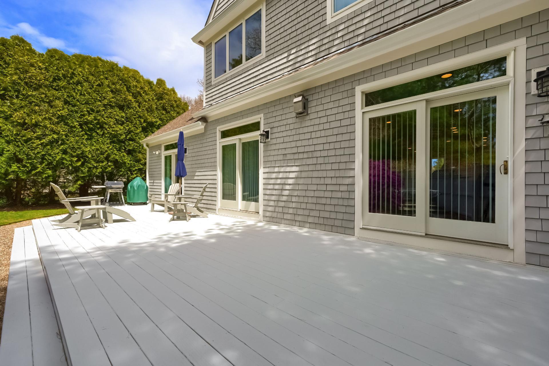 4 Tide Run Mashpee, MA 02649 - Photo 38 of 46 a view of a house with backyard floor and large windows