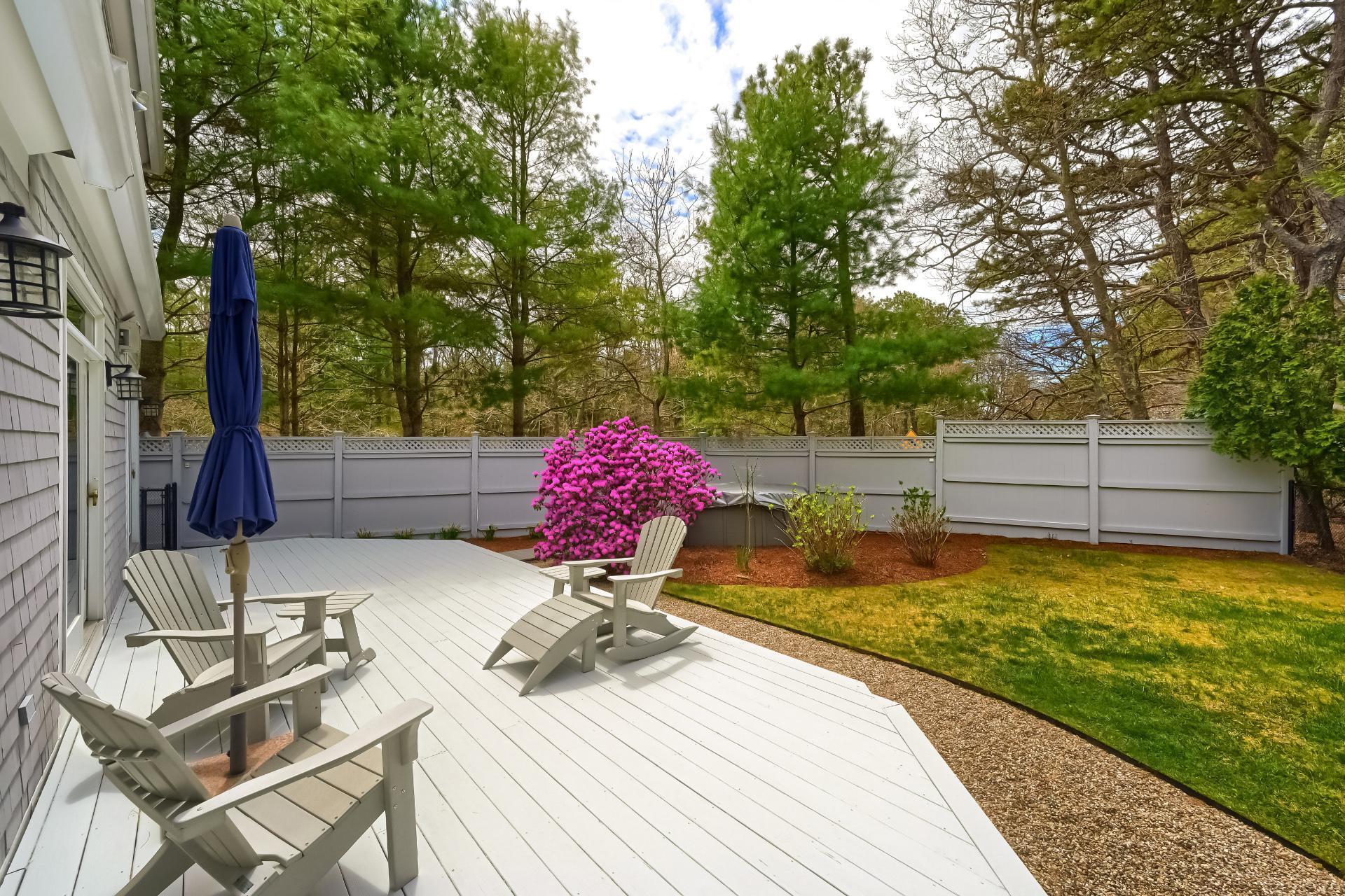 4 Tide Run Mashpee, MA 02649 - Photo 40 of 46 a view of backyard with swimming pool and seating space