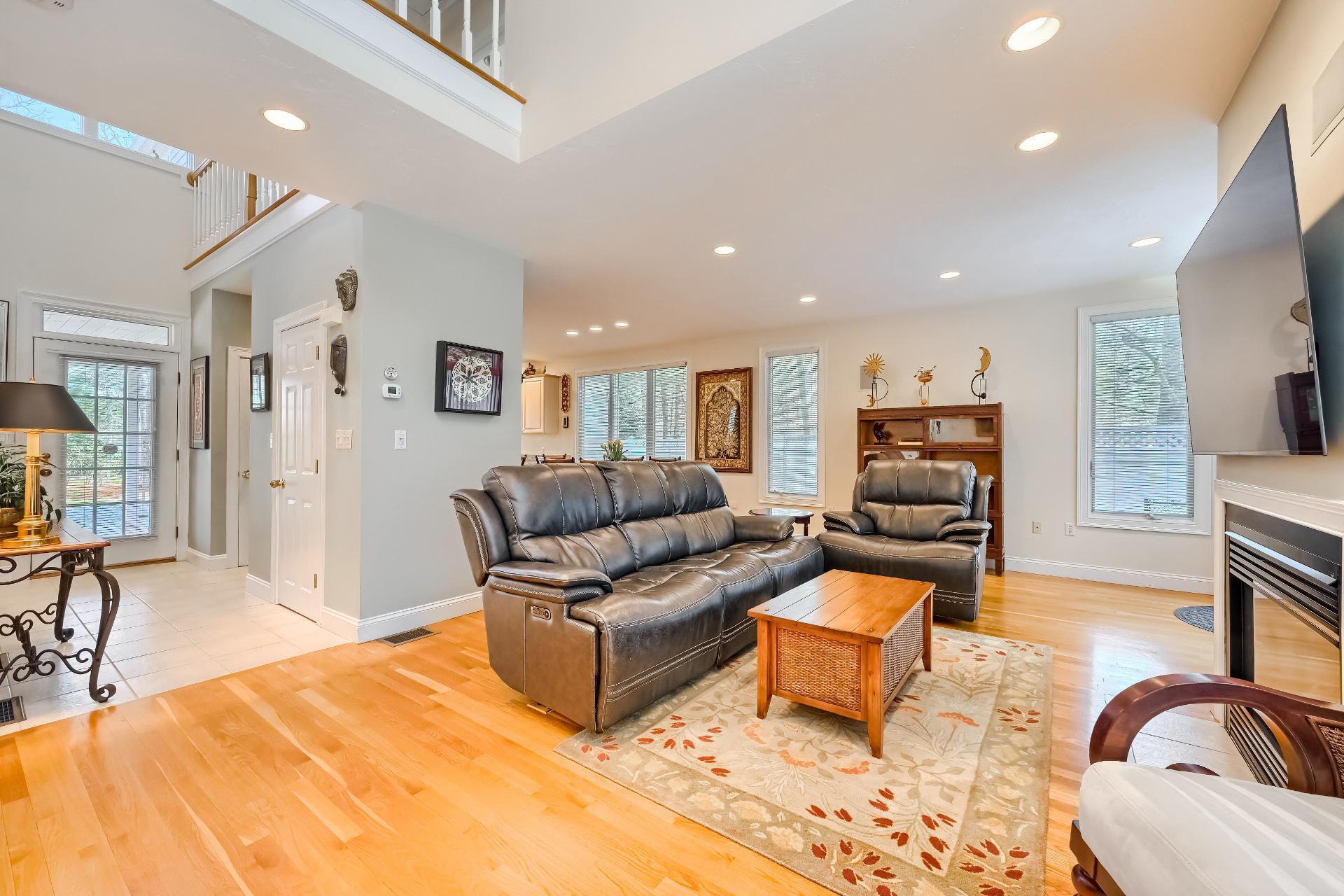 4 Tide Run Mashpee, MA 02649 - Photo 4 of 46 a living room with furniture window and a flat screen tv