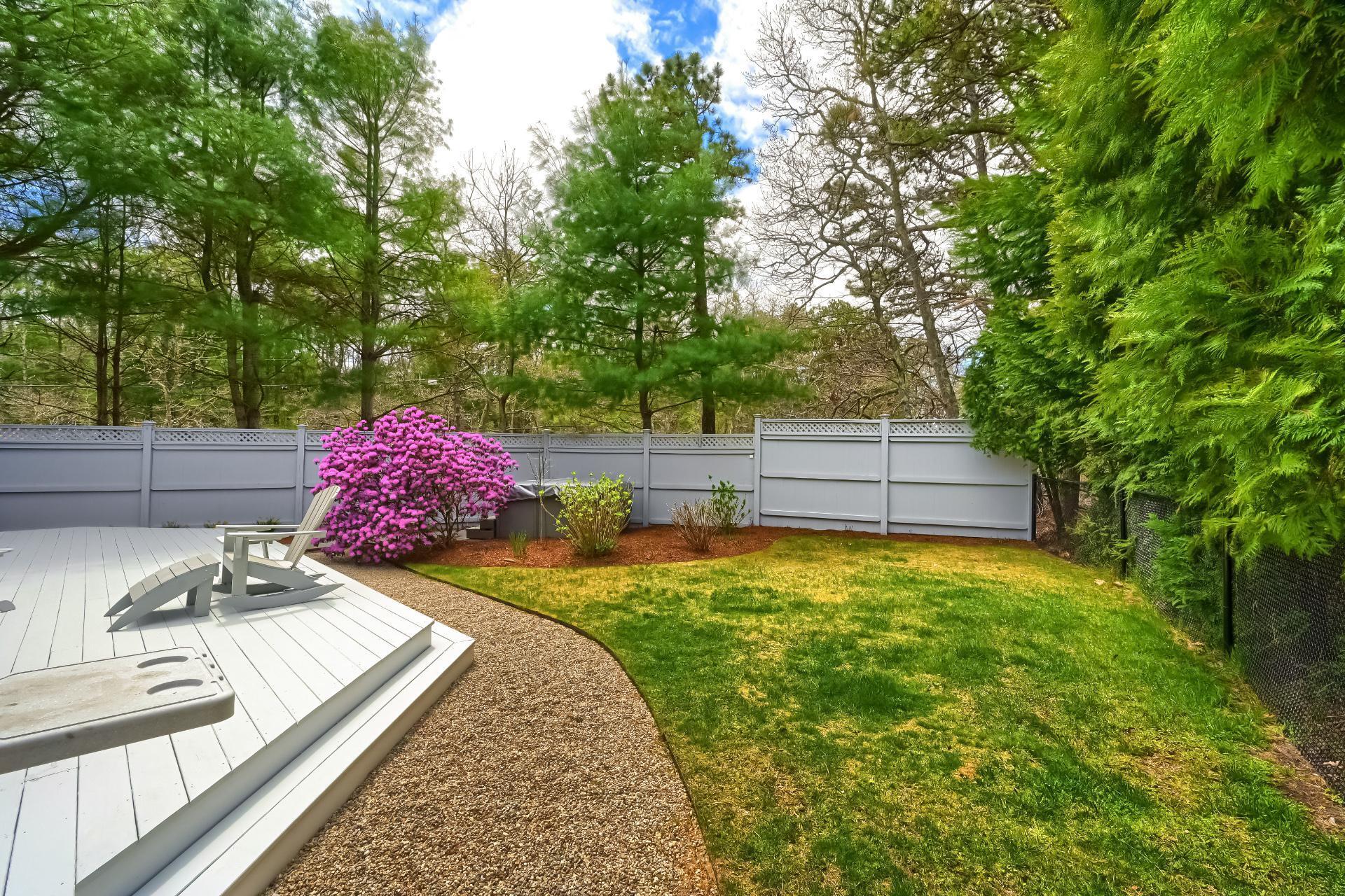 4 Tide Run Mashpee, MA 02649 - Photo 41 of 46 a view of a backyard with a sitting area