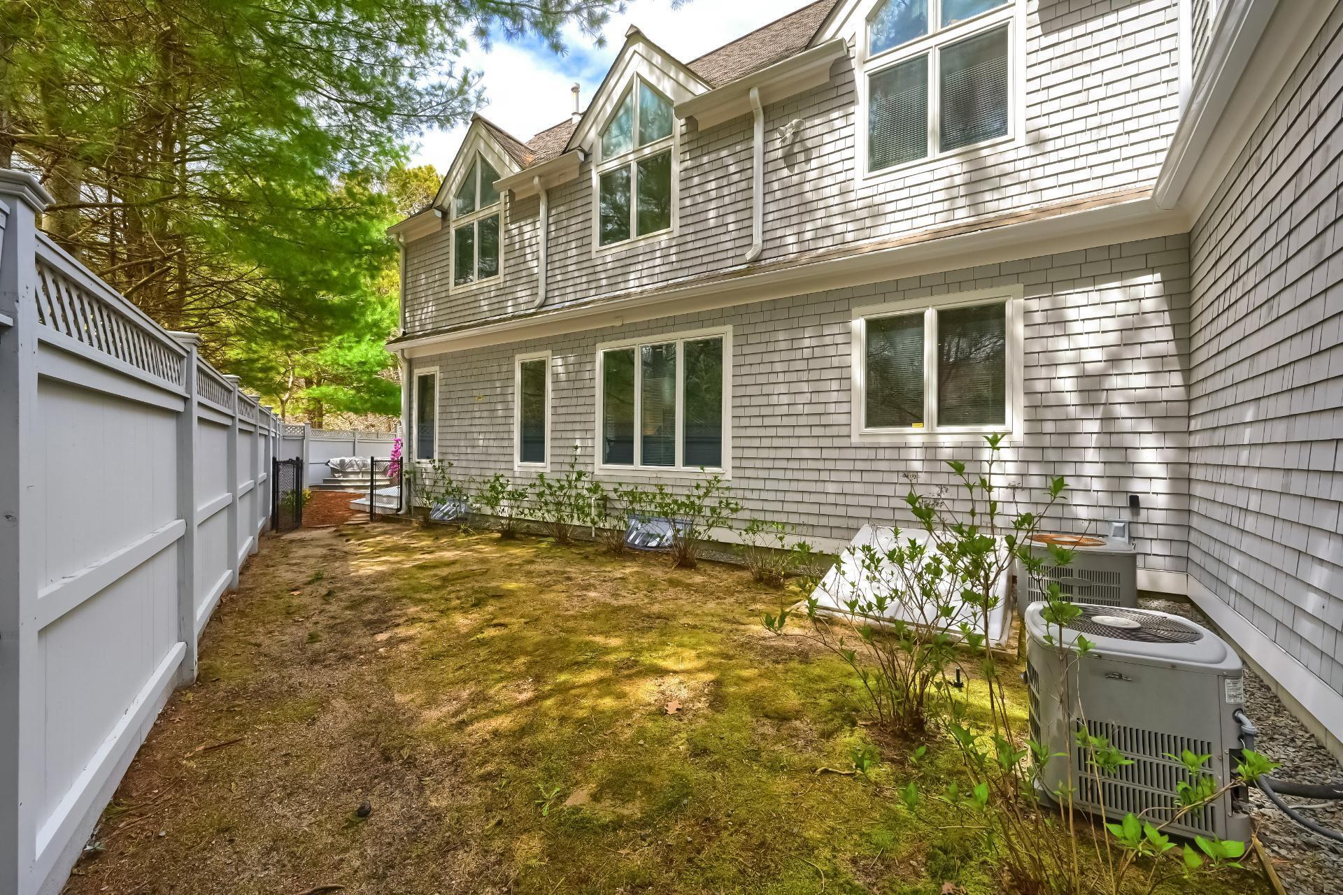 4 Tide Run Mashpee, MA 02649 - Photo 42 of 46 a view of a house with a yard
