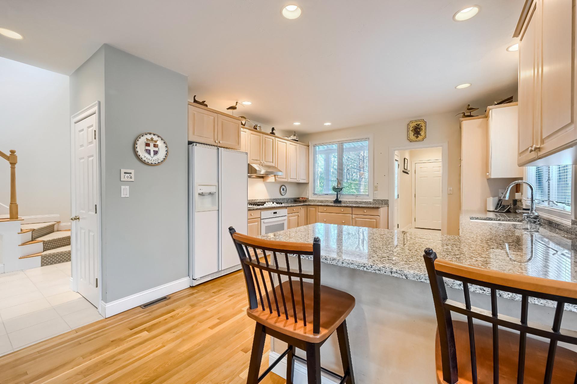 4 Tide Run Mashpee, MA 02649 - Photo 10 of 46 a view of a kitchen with furniture and a wooden floor