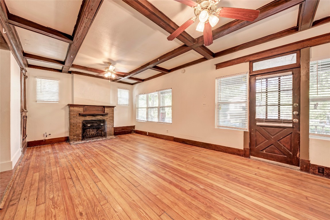 2911 Rio Grande Street Austin, TX 78705 - Photo 2 of 6 a view of empty room with wooden floor and fireplace