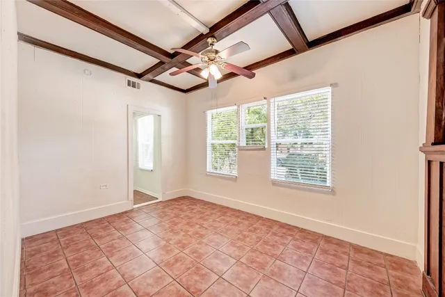 a view of an empty room and a window