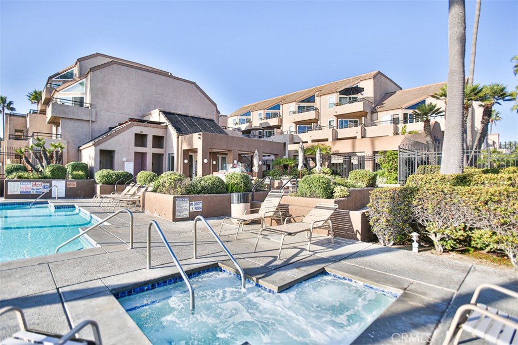 1200 Pacific Coast Highway, Unit 423 Huntington Beach, CA 92648 - Photo 11 of 40 a view of a building with a yard