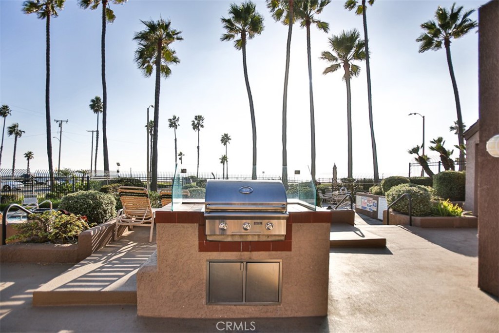 1200 Pacific Coast Highway, Unit 423 Huntington Beach, CA 92648 - Photo 13 of 40 a view of outdoor space with trees