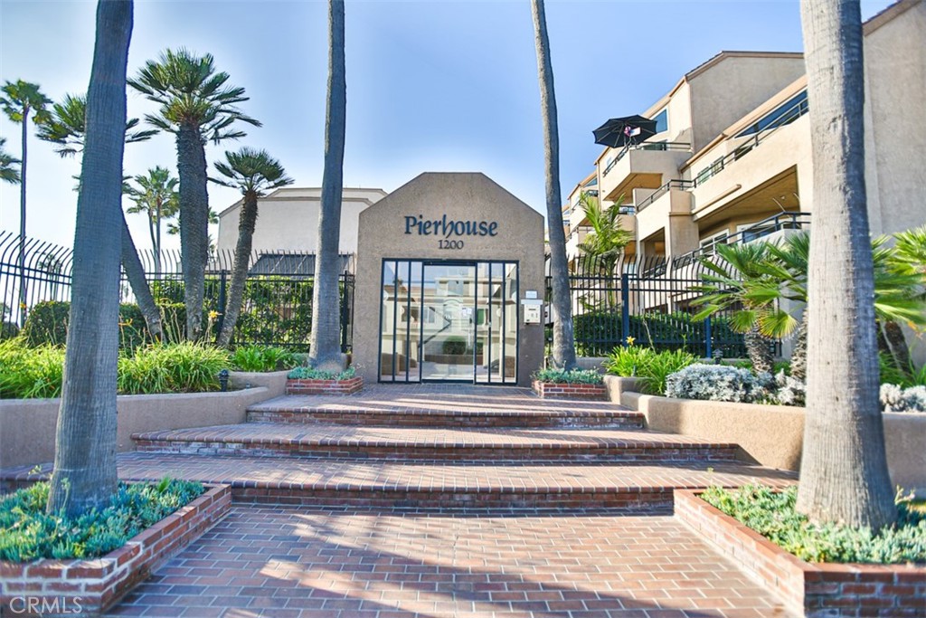 1200 Pacific Coast Highway, Unit 423 Huntington Beach, CA 92648 - Photo 14 of 40 a front view of a house with a porch