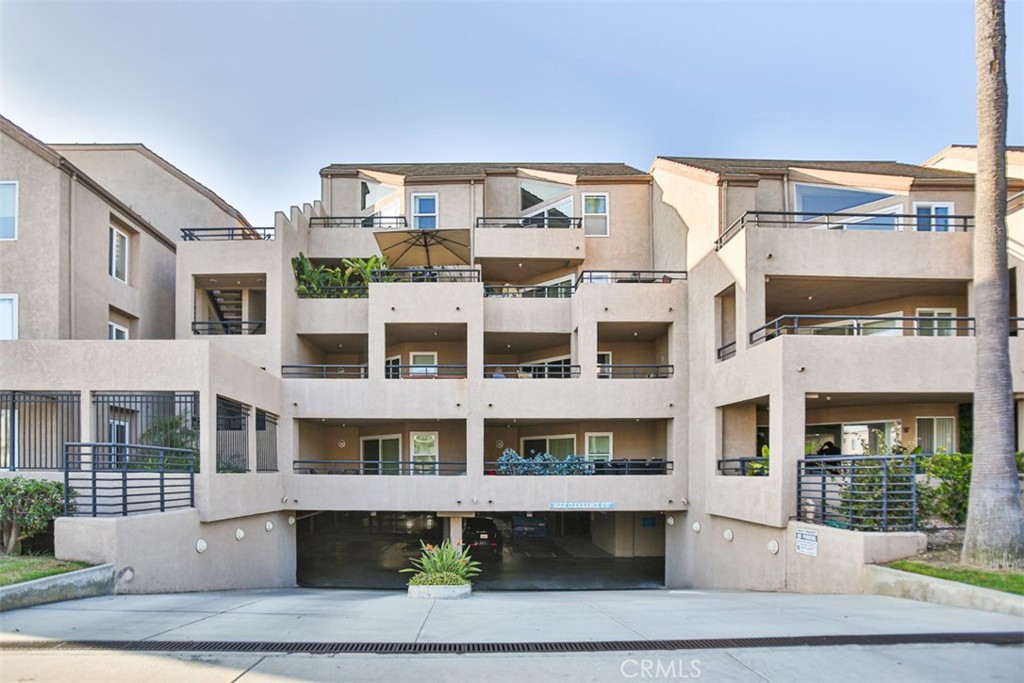 1200 Pacific Coast Highway, Unit 423 Huntington Beach, CA 92648 - Photo 15 of 40 a front view of a building with a lot of windows