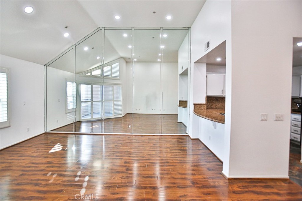 1200 Pacific Coast Highway, Unit 423 Huntington Beach, CA 92648 - Photo 28 of 40 a view of an empty room with wooden floor