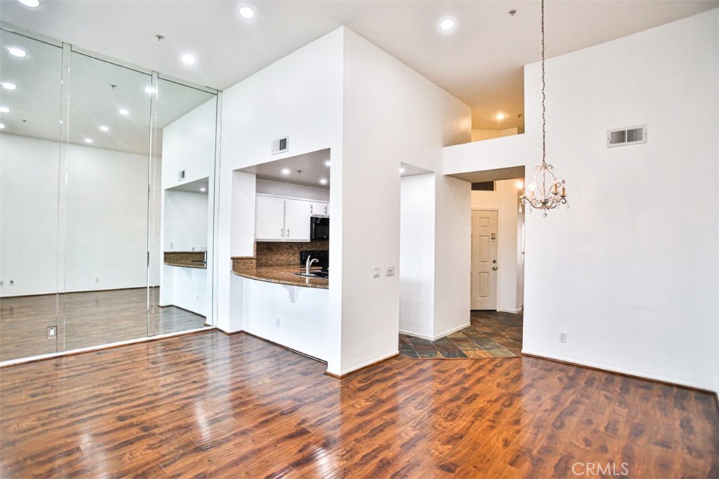 1200 Pacific Coast Highway, Unit 423 Huntington Beach, CA 92648 - Photo 29 of 40 a view of a kitchen cabinets and a room wooden floor
