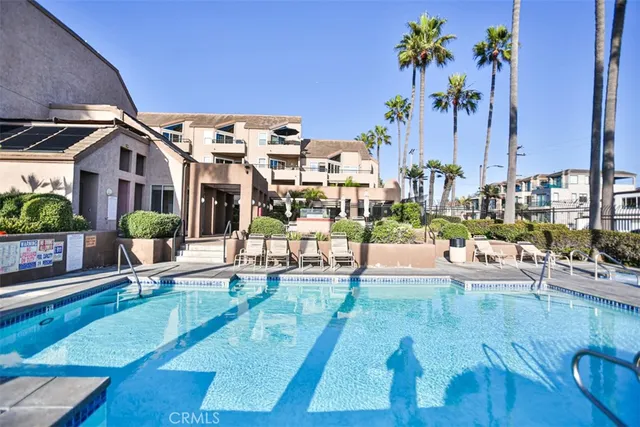 a view of a swimming pool with outdoor seating