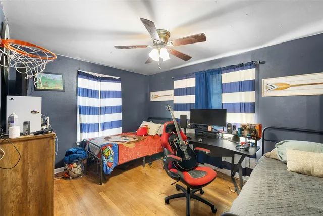 a white toilet sitting next to a bathroom sink and a shower