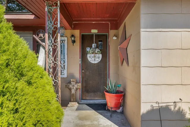 a front view of a house with outdoor seating