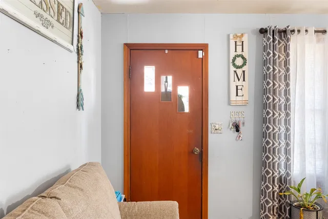 a view of walk in closet with clothes