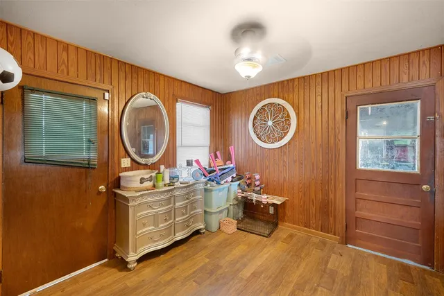 a bedroom with double bed and a window