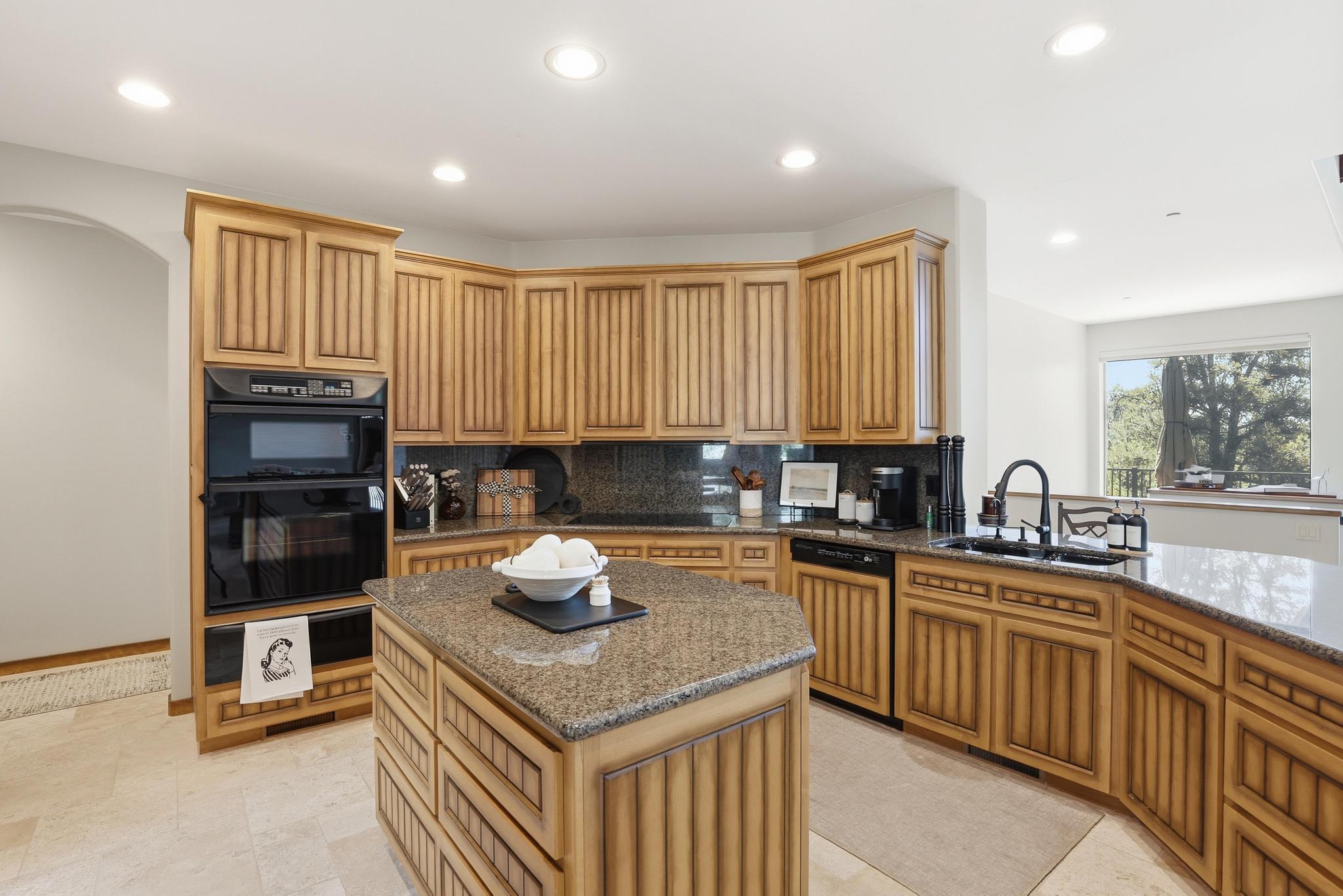 2908 East Rim Club Drive Payson, AZ 85541 - Photo 21 of 77 a kitchen with a sink stove and cabinets