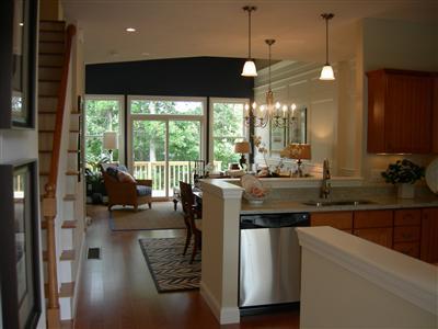 45 Grey Hawk Drive, Unit 578 Mashpee, MA 02649 - Photo 2 of 6 a kitchen with a large window cabinets and living room view